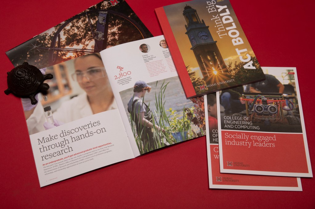 Overhead view of brochures from Miami University sitting on a table.